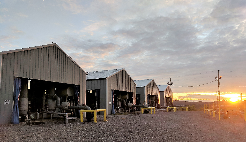 Warehouses picture with a sunset in the horizon